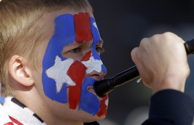 A soccer fan blows a vuvuzela at Ellis Park stadium in Johannesburg, South Africa, Friday prior to the match between U.S. and Slovenia in a soccer World Cup Group C match.